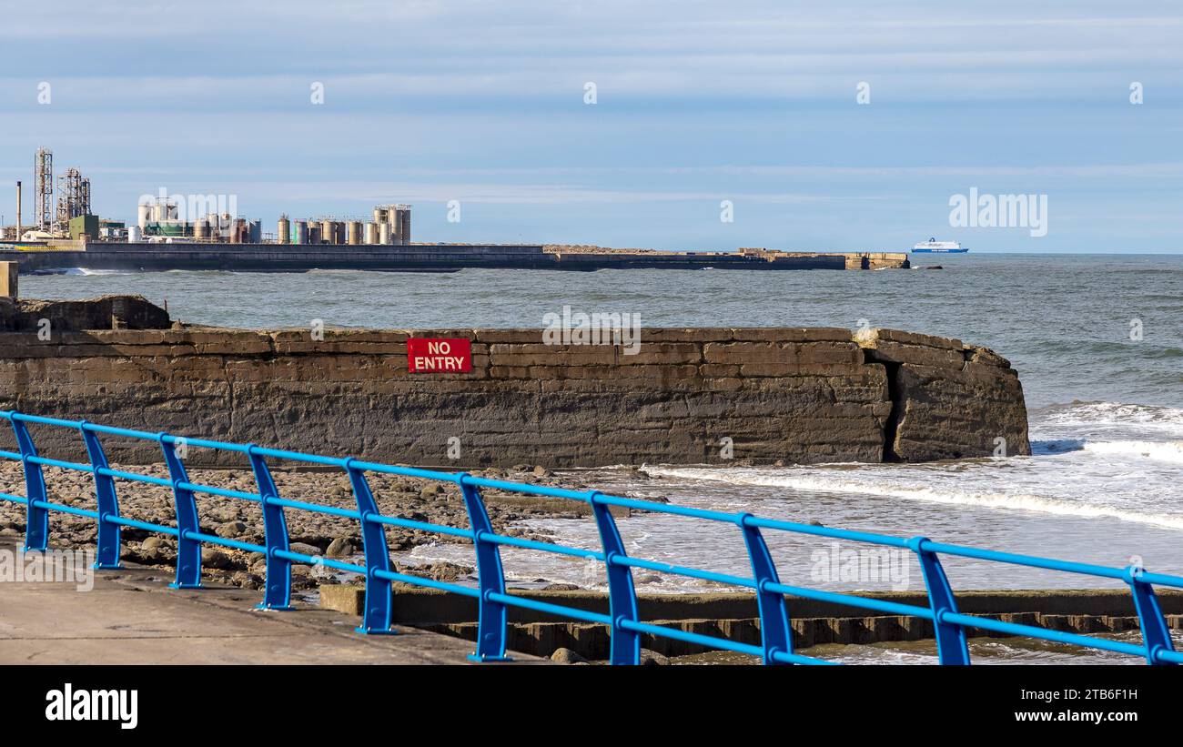 A breaking wall on Grangetown Beach, Tyne and Wear, England, UK Stock Photo