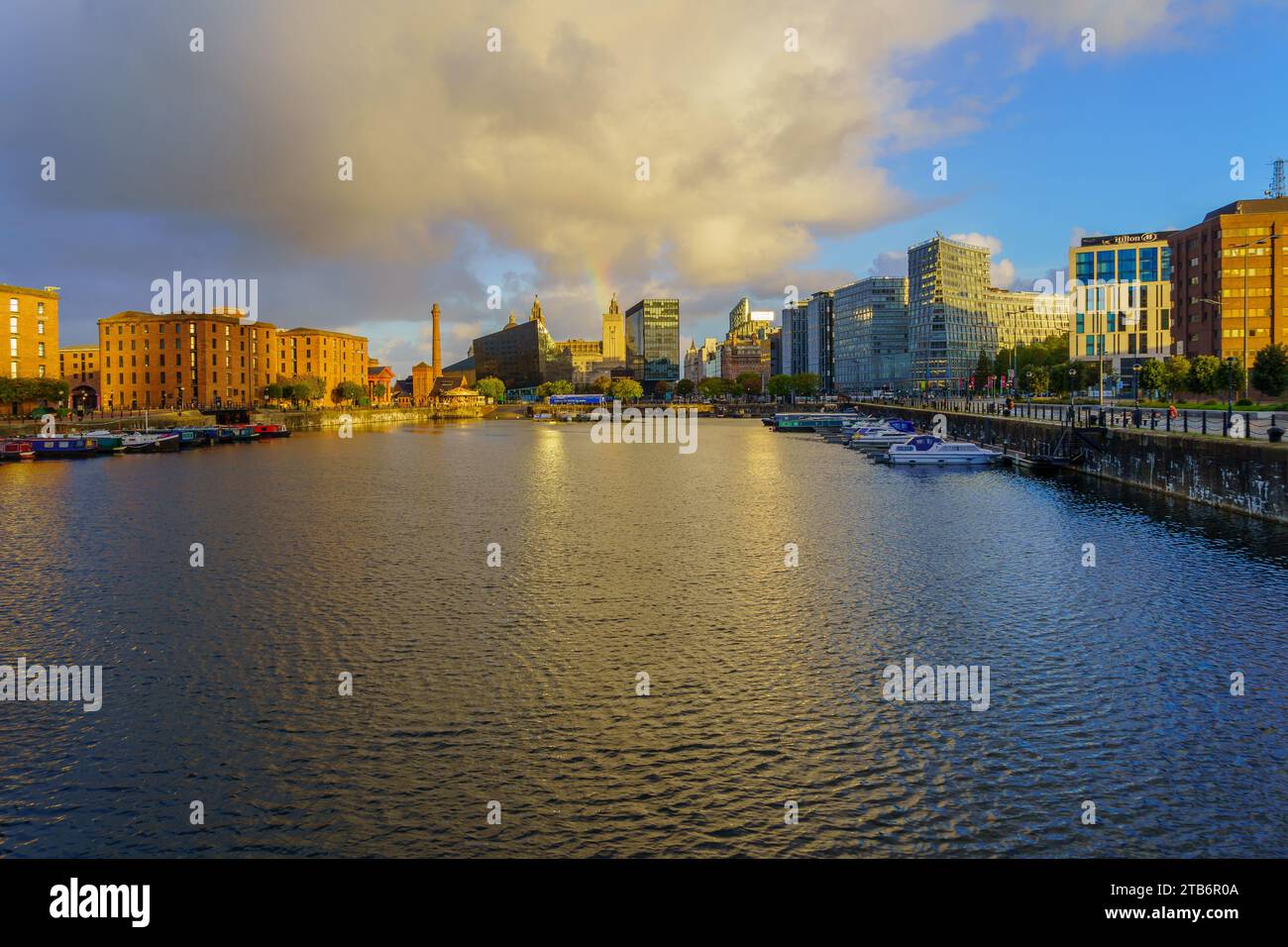 Liverpool, UK - October 08, 2022: Sunrise view of the Royal Albert Dock, with various buildings, in Liverpool, Merseyside, England, UK Stock Photo