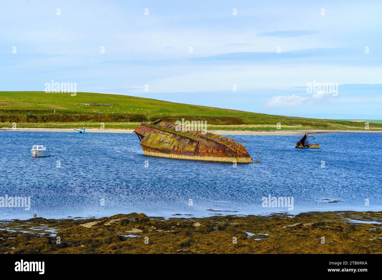 View of causeway and shipwrecks (SS Reginald Blockship), in the Orkney Islands, Scotland, UK Stock Photo