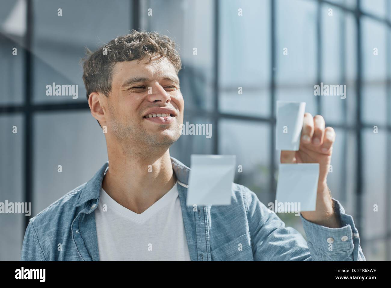 Black male making notes hi-res stock photography and images - Alamy