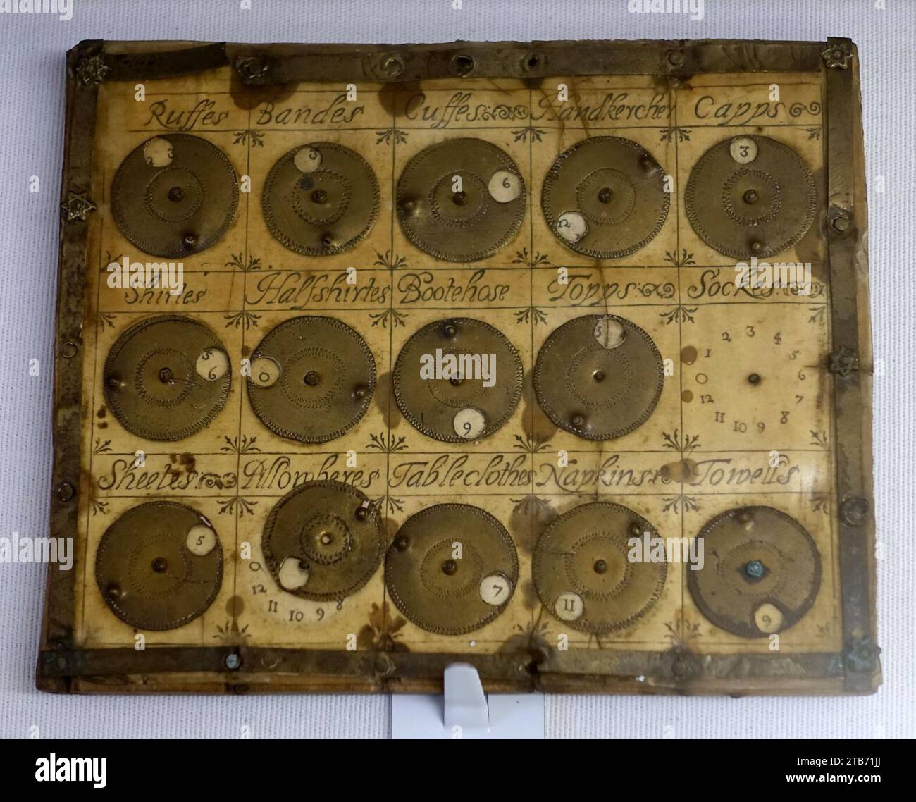 Washing tally, England, 1650-1700, brass, printed sheet covered with talc Stock Photo