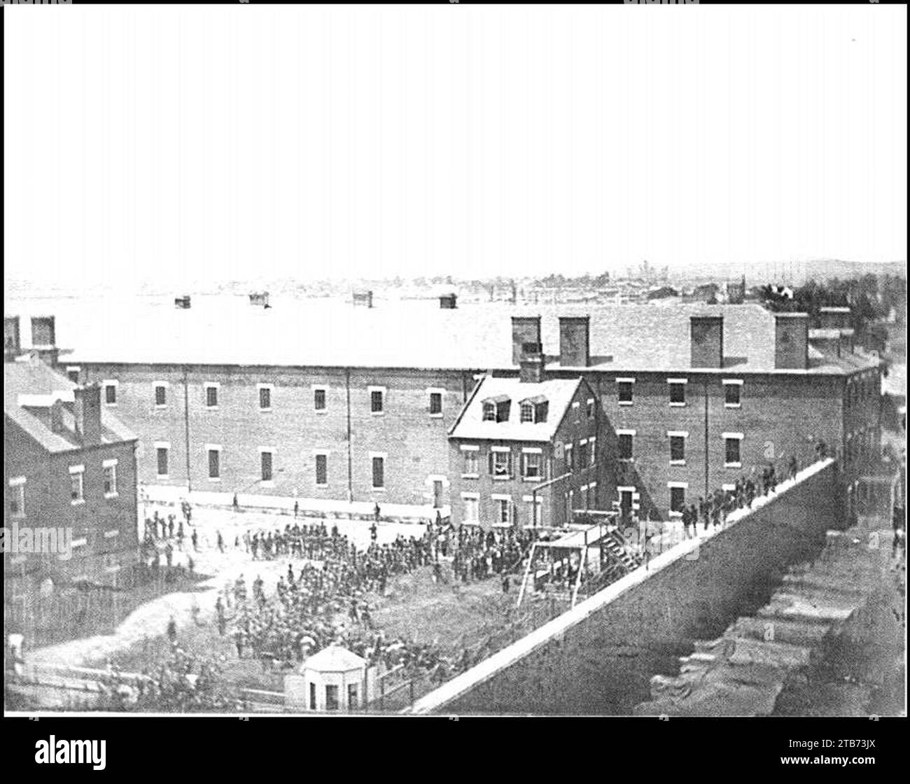 Washington, D.C. Execution of the conspirators- scaffold in use and crowd in the yard, seen from the roof of the Arsenal Stock Photo