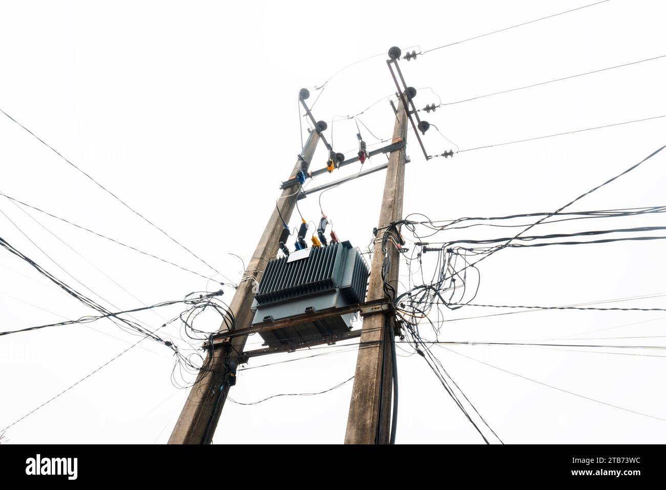 High voltage power lines tower with a blue sky background Stock Photo ...