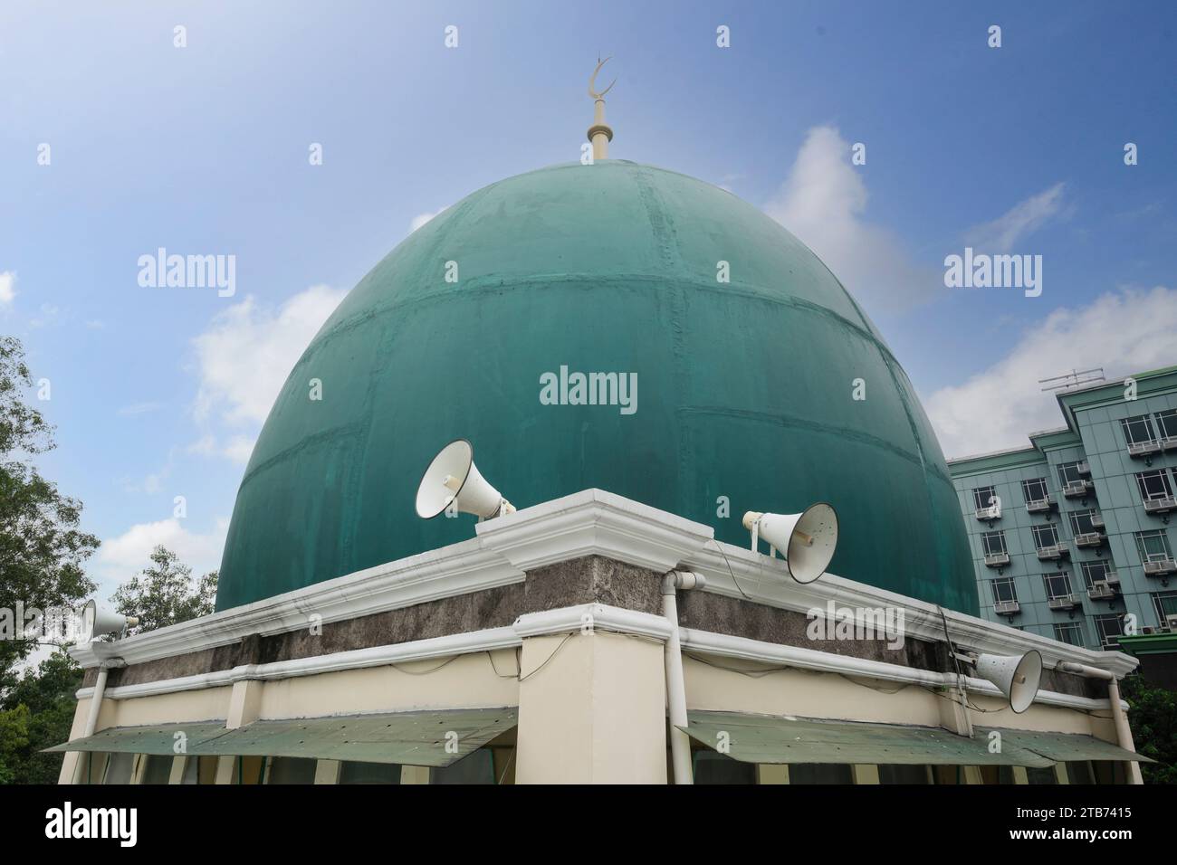 The dome of the mosque with a blue sky background Stock Photo - Alamy