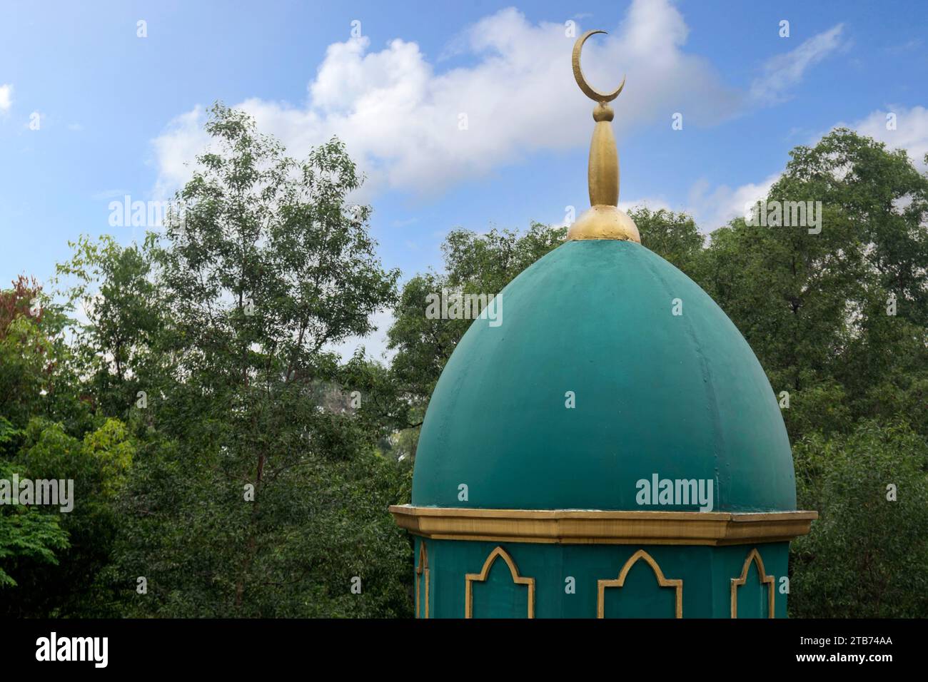 The dome of the mosque with a blue sky background Stock Photo - Alamy