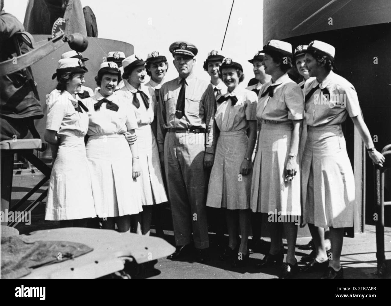 WAVES officers pose aboard USS General Omar Bundy (AP-152) on 25 June ...