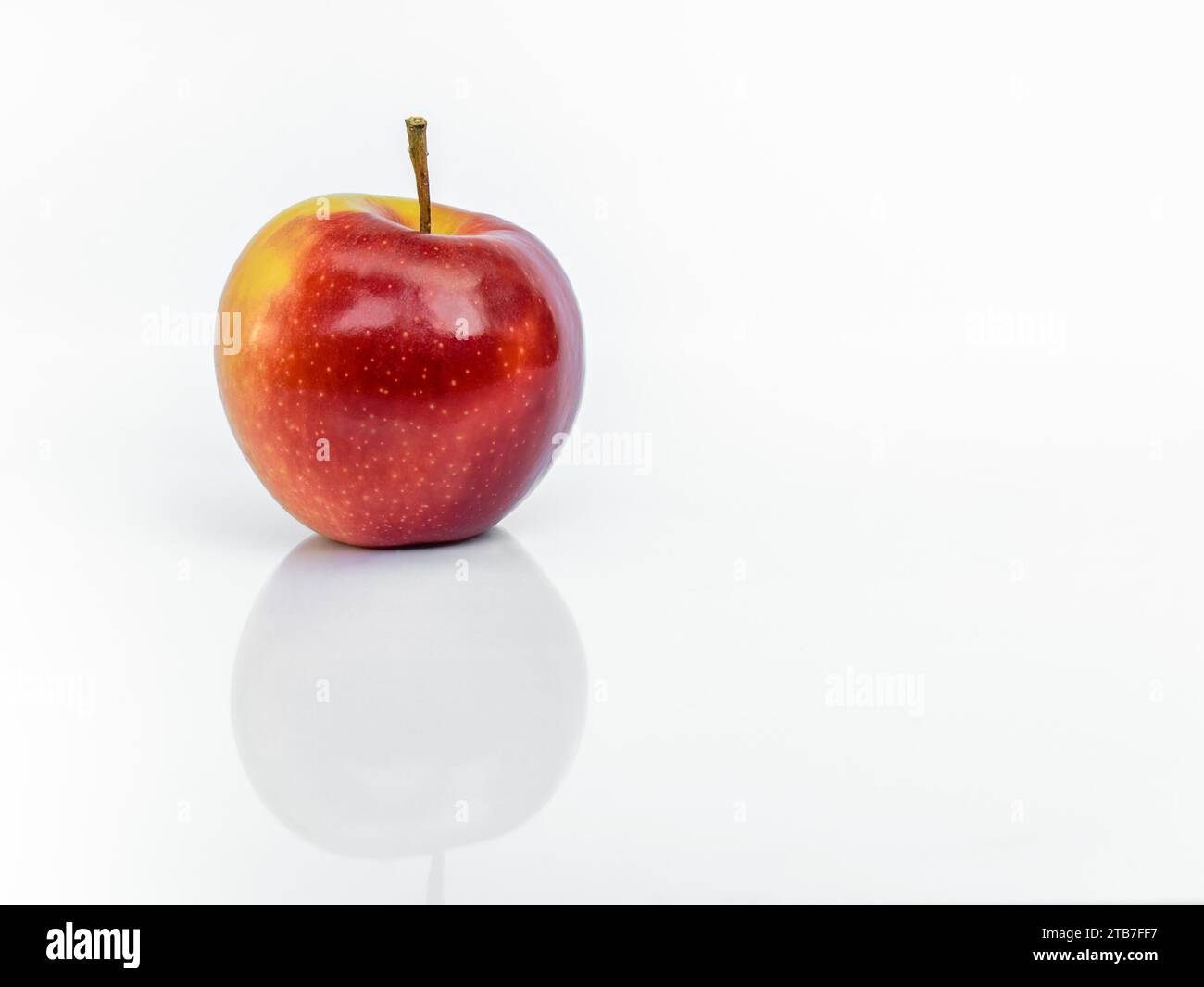 Red ripe Gala apple isolated on white background with reflection Stock Photo