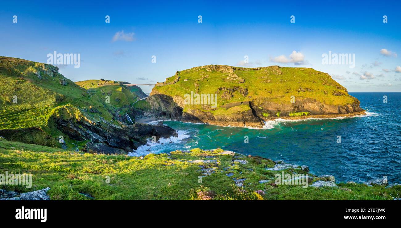15 May 2023:Tintagel, Cornwall - Panoramic view of Tintagel Castle, legendary birthplace of King Arthur,. on the mainland and the Island, with the... Stock Photo