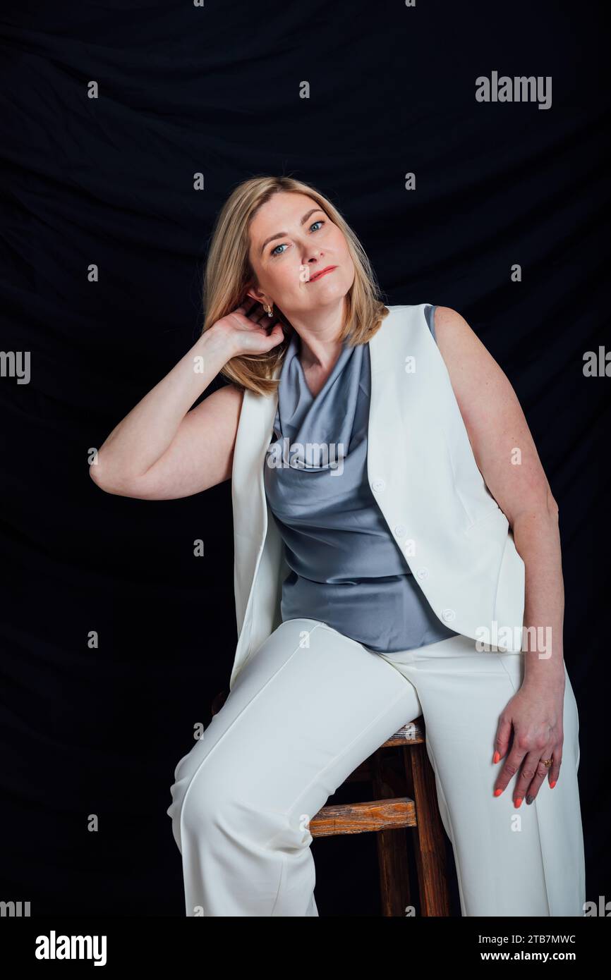 adult woman in white business suit in office Stock Photo - Alamy