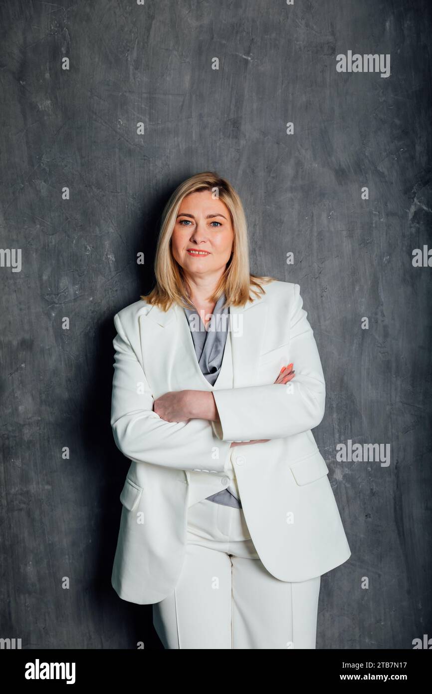 adult woman in white business suit in office Stock Photo - Alamy