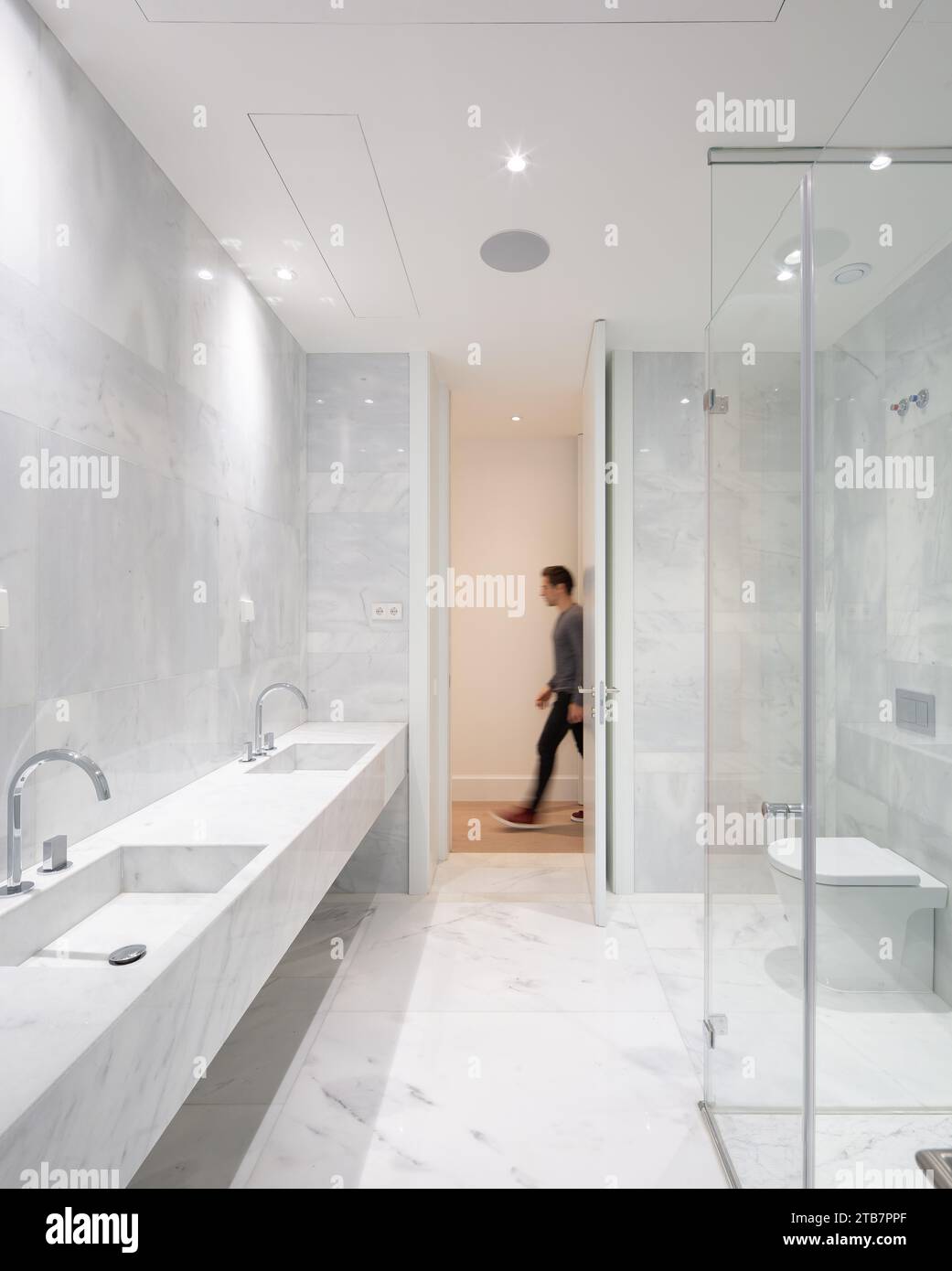 Shower cabin with two marble sinks and toilet bowl in illuminated ... - Penthouse Apartments With Marble Shower Walls