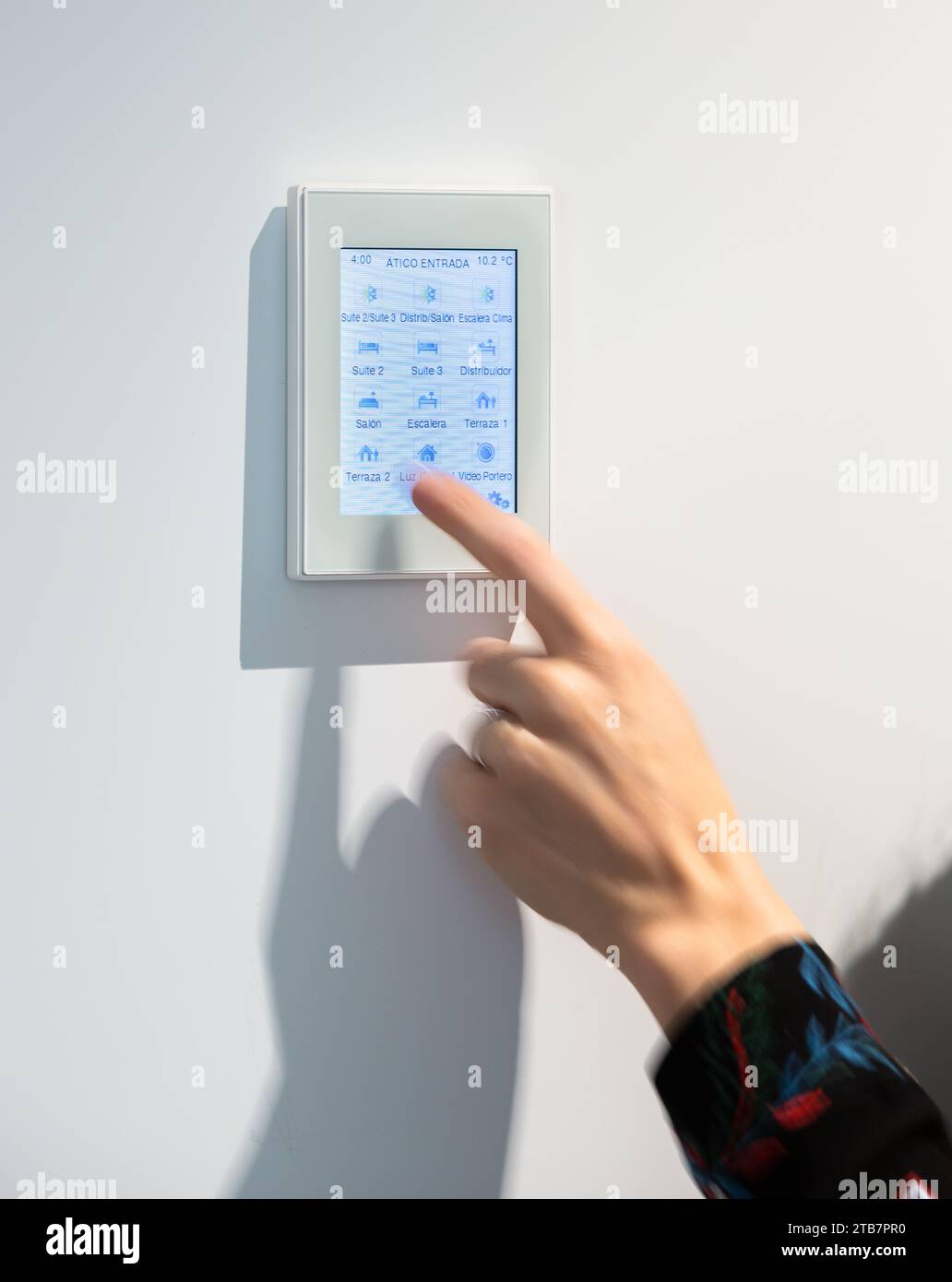 Image showcasing Crop hand of anonymous woman adjusting temperature on thermostat ...