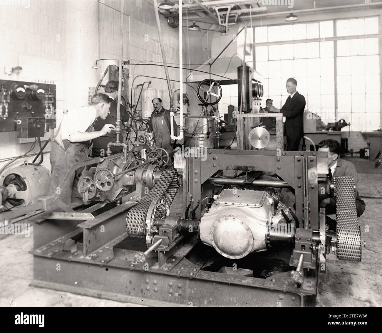 Doble testing lab with technicians and engine Vintage car picture