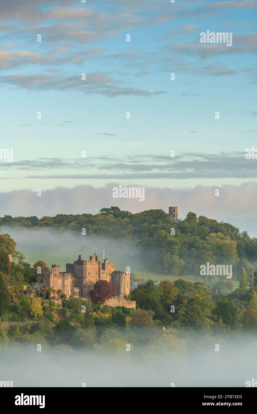 Dunster Castle emerges from swirling morning mist, Exmoor National Park ...