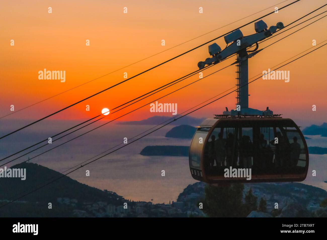 An aerial view of a ropeway over the sea at sunset Stock Photo - Alamy