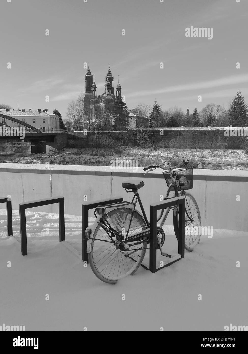 A locked bicycle close by the Jordan bridge and the Piotr and Pawel cathedral in Poznan, Poland. Stock Photo