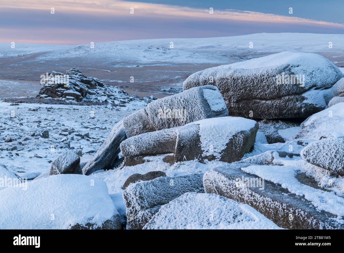 Snow covered granite outcrops at Belstone Tor in Dartmoor National Park, Devon, England.  Winter (December) 2022. Stock Photo