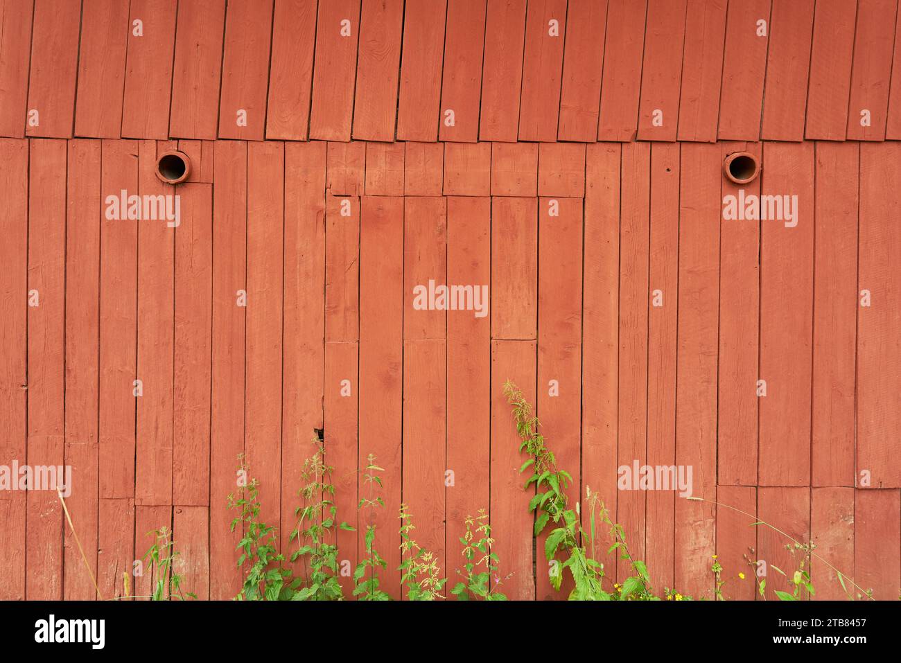 Old red painted wooden barn as wood background texture Stock Photo