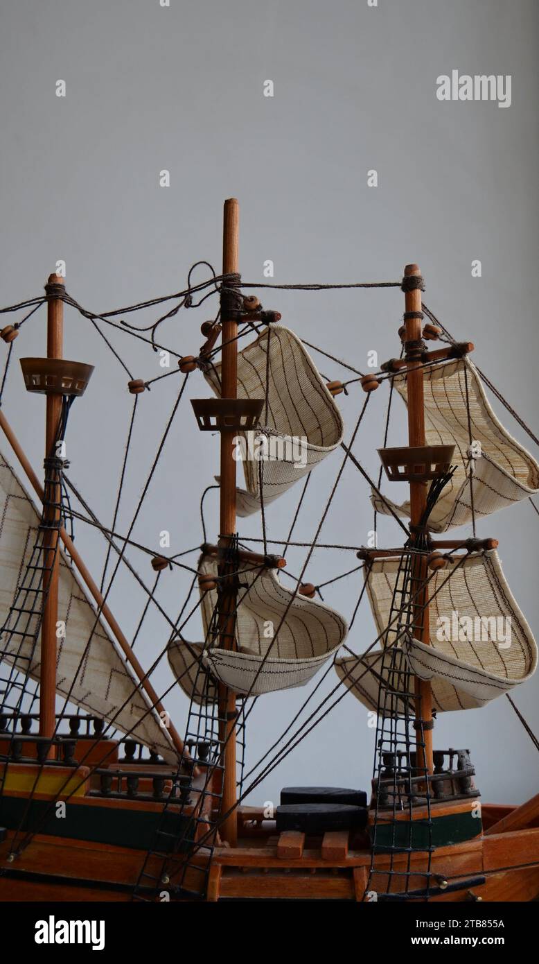 Sailing Masts Of Scale Model Wooden Ship On A White Background Stock Photo