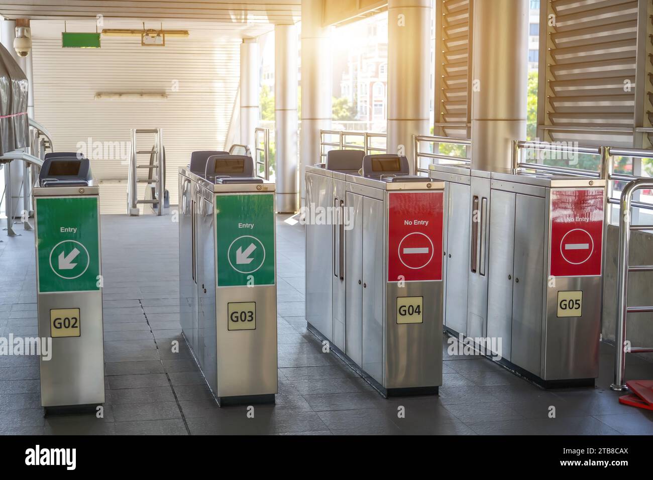 Modern train station entrance open gates with electronic card readers
