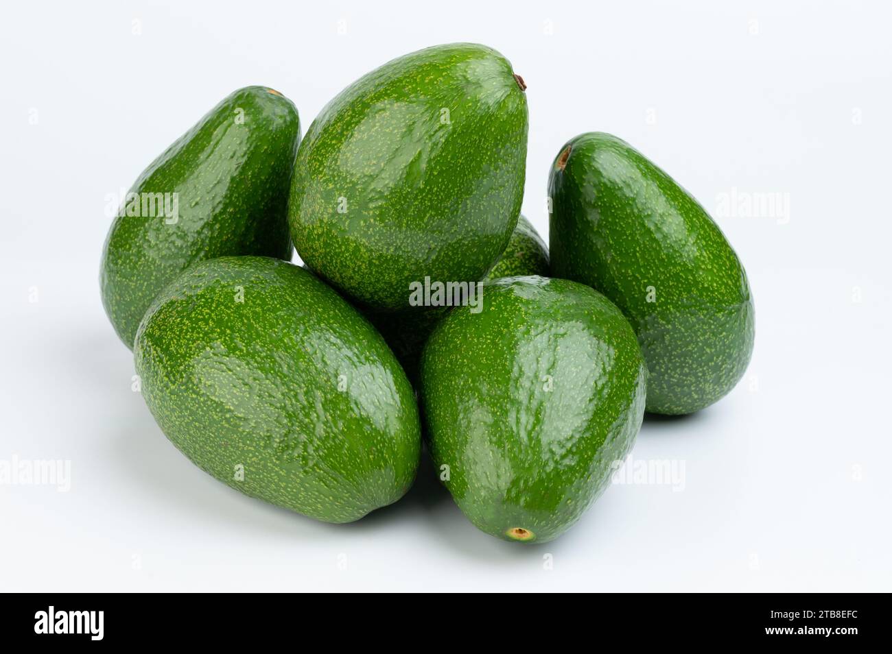 Pile of group green avocados isolated on white studio background Stock Photo