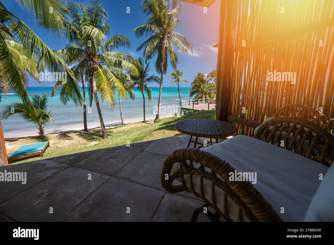 Terrace with table and chair infornt of Caribbean sea beach background Stock Photo
