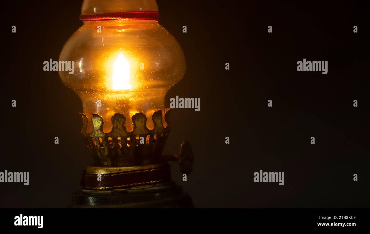 Old vintage kerosene black lamp isolated on black background with copy space Stock Photo
