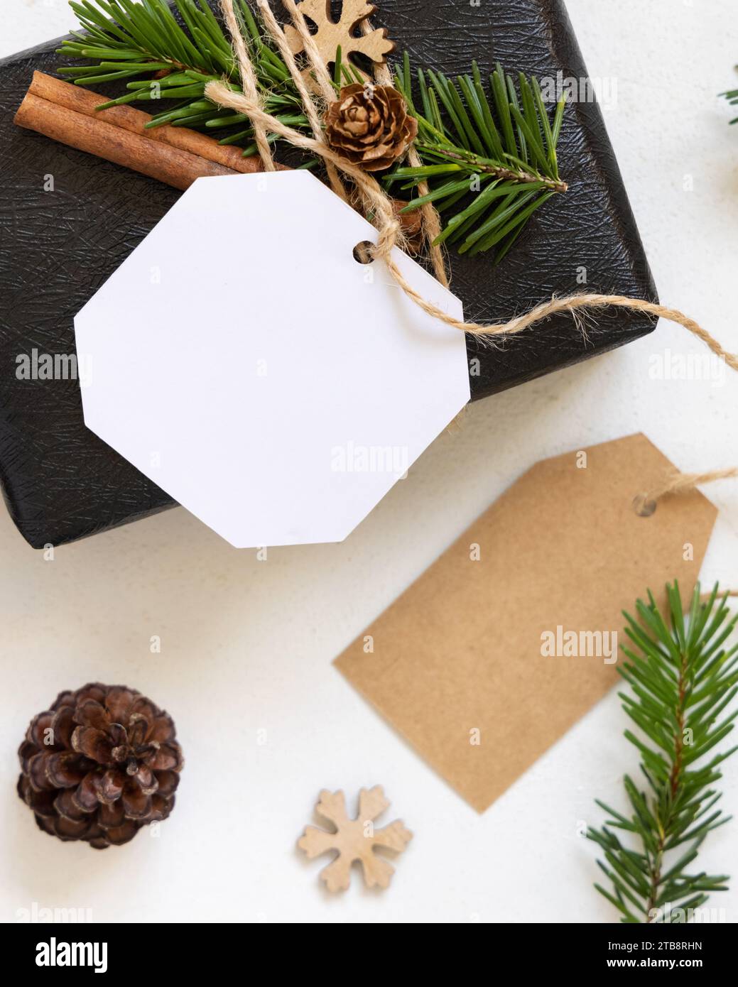 Blank gift tags with pine branch and Christmas cookies on textile  background. The concept of preparing for the Christmas holiday, Stock  image