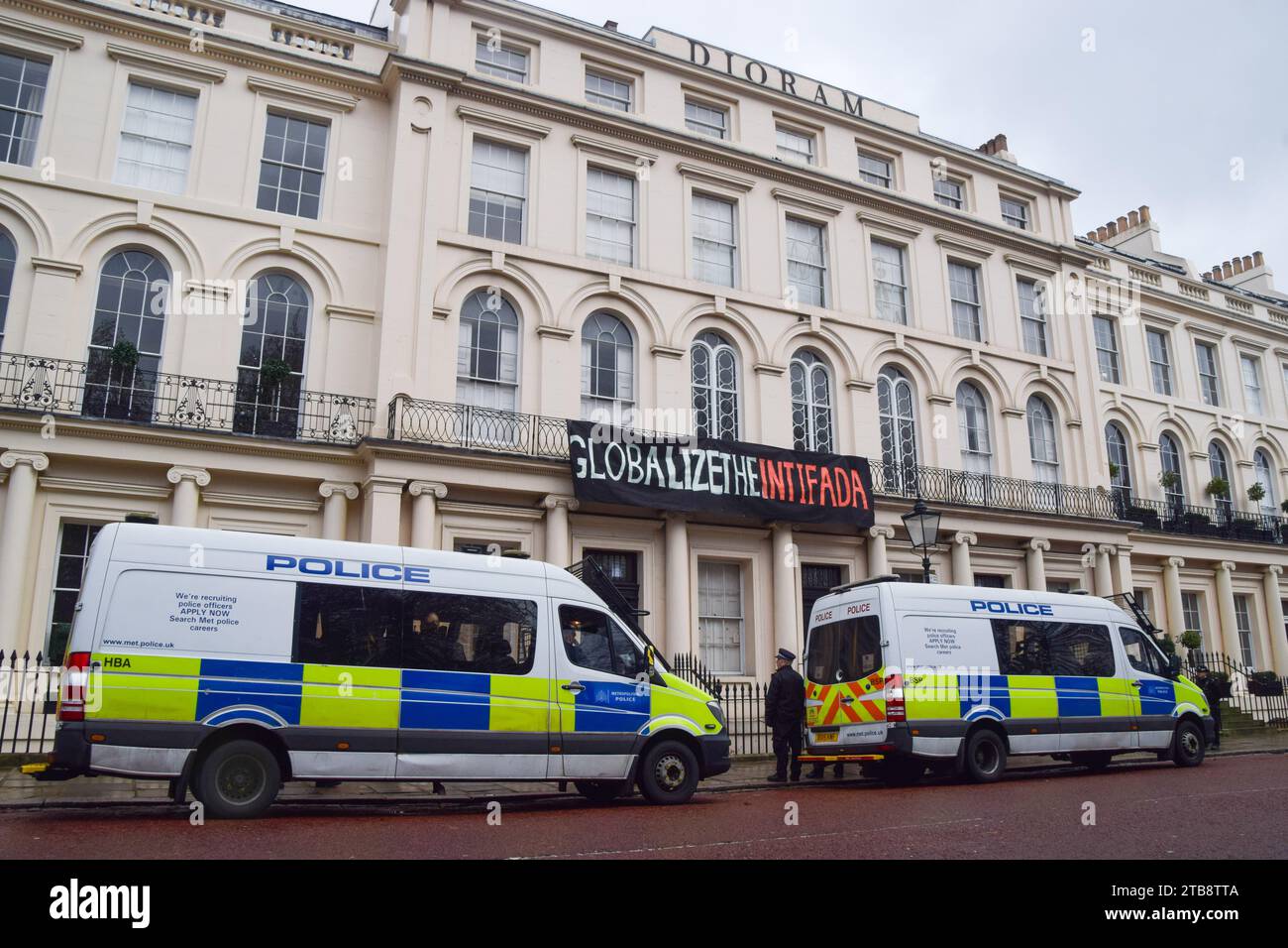 London, UK. 5th December 2023. Police arrive as pro-Palestine squatters hang a banner stating 'Globalize the Intifada' outside the Diorama building next to Regent’s Park. Credit: Vuk Valcic/Alamy Live News Stock Photo