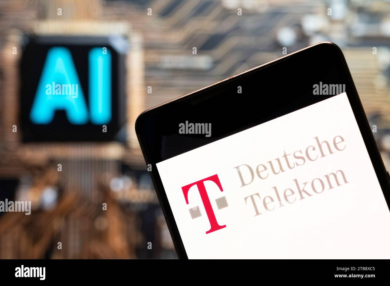 In this photo illustration, the German telecommunications company Deutsche Telekom AG logo seen displayed on a smartphone with an Artificial intelligence (AI) chip and symbol in the background. Stock Photo