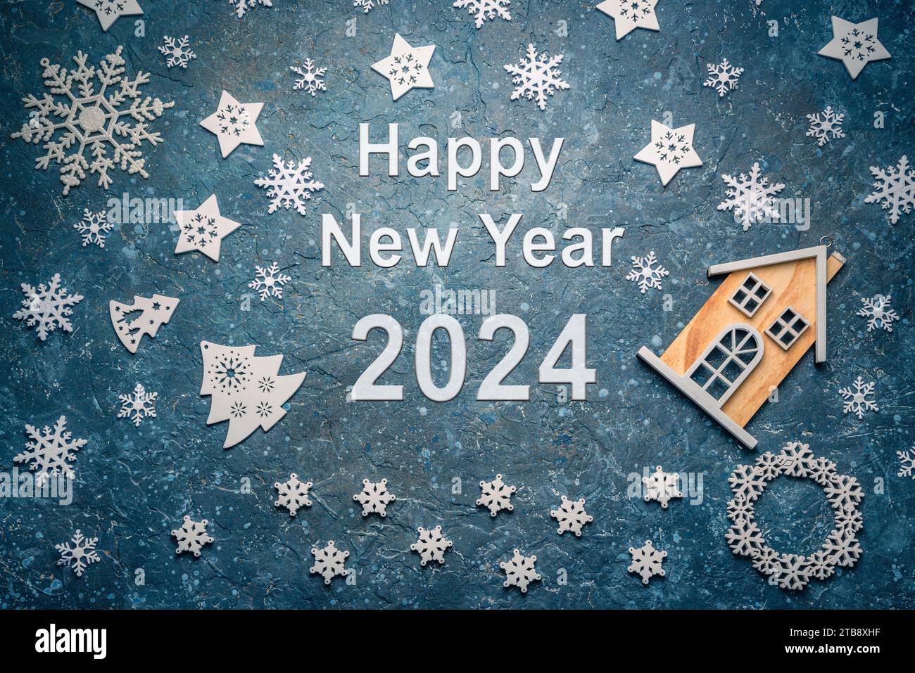 Happy new Year 2024 on a Christmas blue background with icing decoration Stock Photo