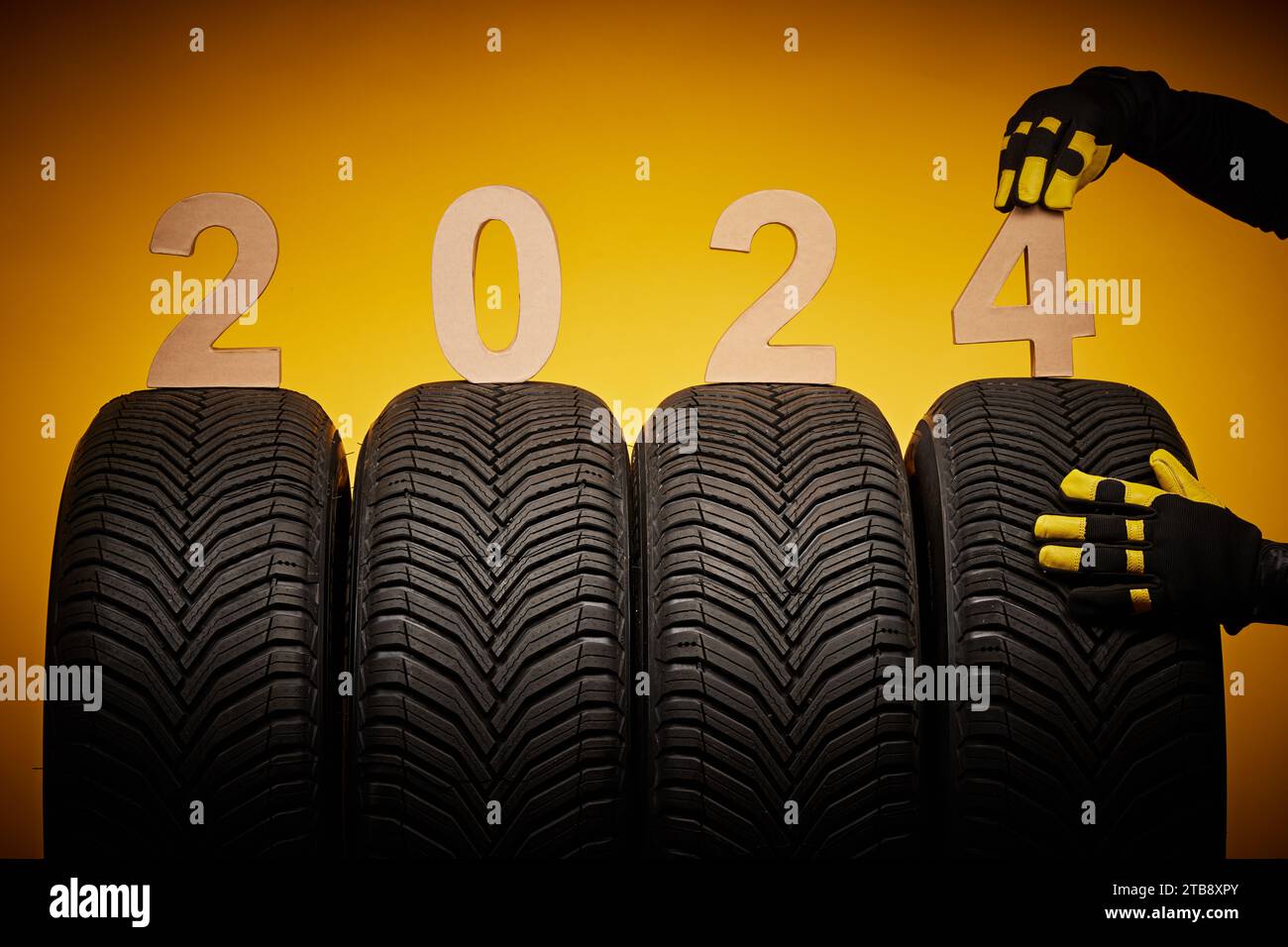 Winter car tires service and thumbs up hands of mechanic and text 2024