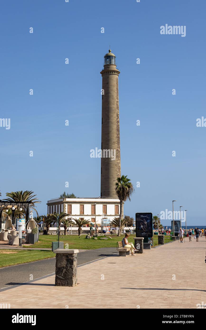 Gran Canaria, Spain - November 23, 2023: Maspalomas  Lighthouse in Gran Canaria, spain,  at the promenade with tourists Stock Photo