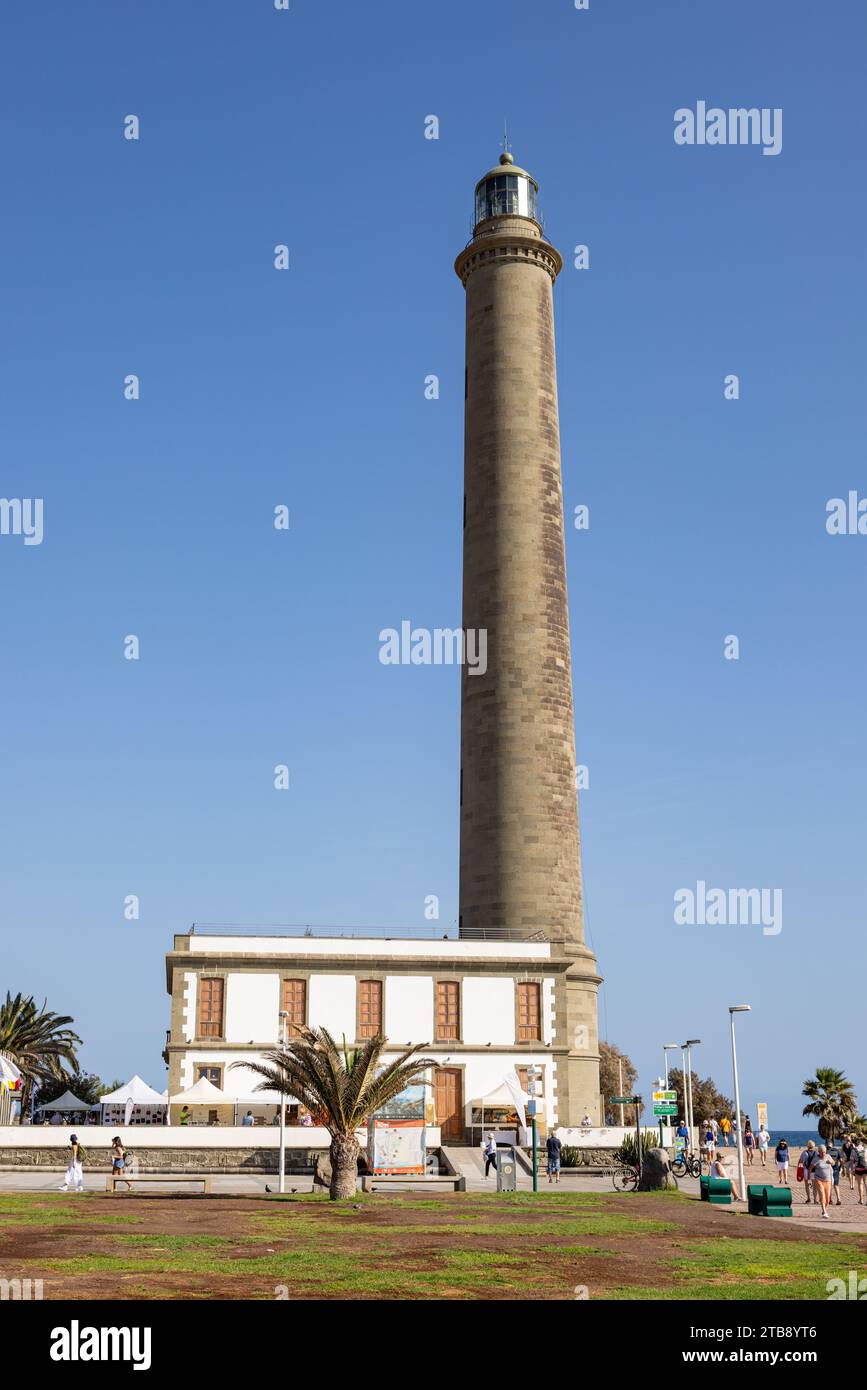 Maspalomas, Gran Canaria, Spain - November 23, 2023: Maspalomas  Lighthouse in Gran Canaria, spain,  at the promenade with tourists enjoying the sun Stock Photo