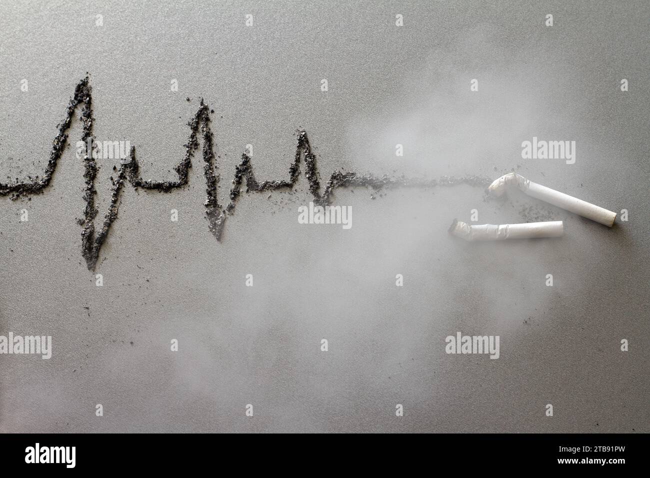 Cigarettes and cardiogram made of ash in fumes of smoke, harmful effects of cigarette smoking, creative concept Stock Photo