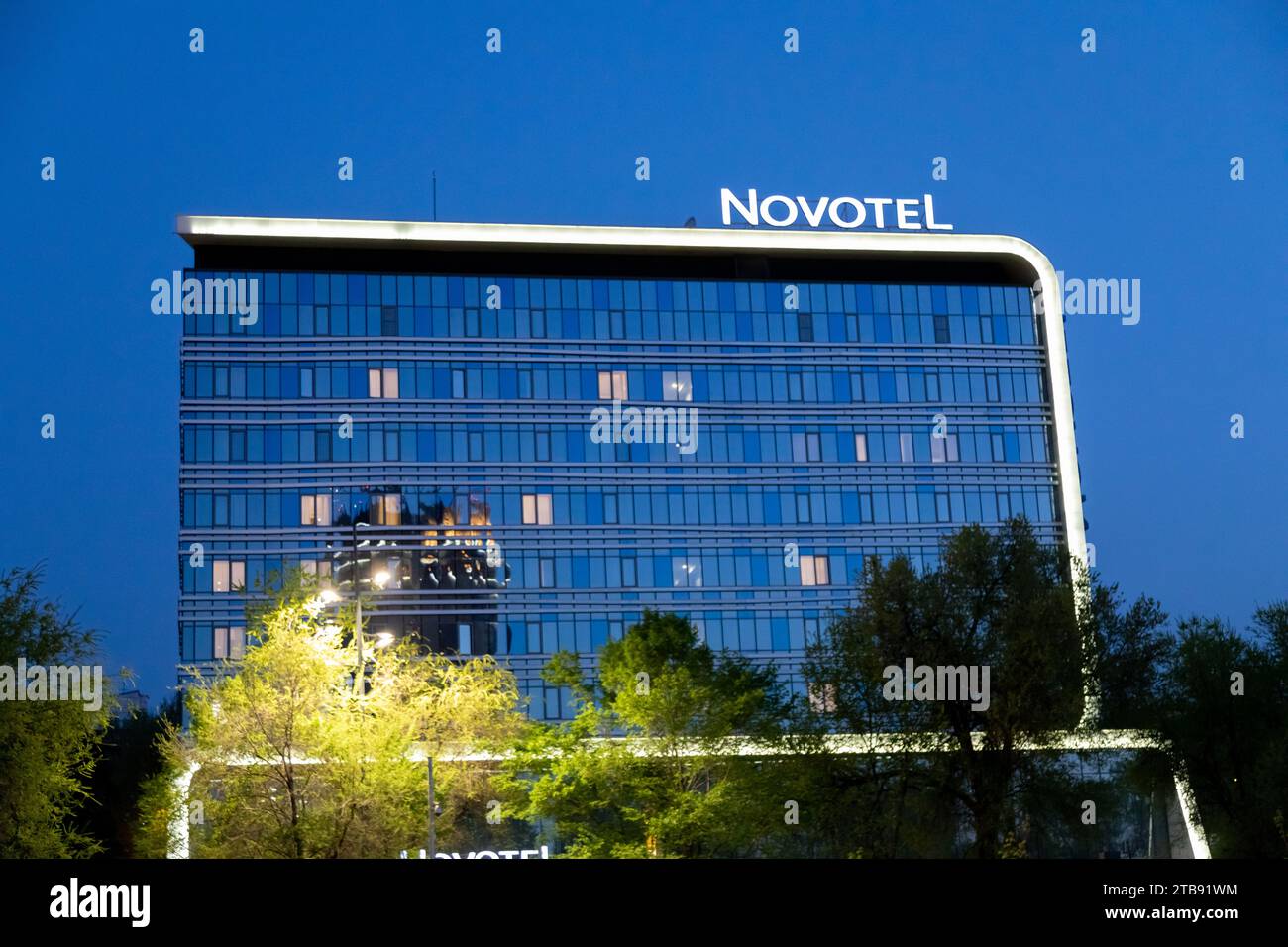 Almaty Kazakhstan April 28 2023 Novotel Hotel With Kok Tobe Hill Almaty Kazakhstan April 28 2023 Novotel Hotel With Kok Tobe Hill