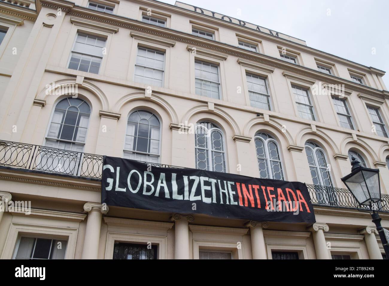 London, UK. 5th December 2023. Pro-Palestine squatters hang a banner stating 'Globalize the Intifada' outside the Diorama building next to Regent’s Park. Credit: Vuk Valcic/Alamy Live News Stock Photo