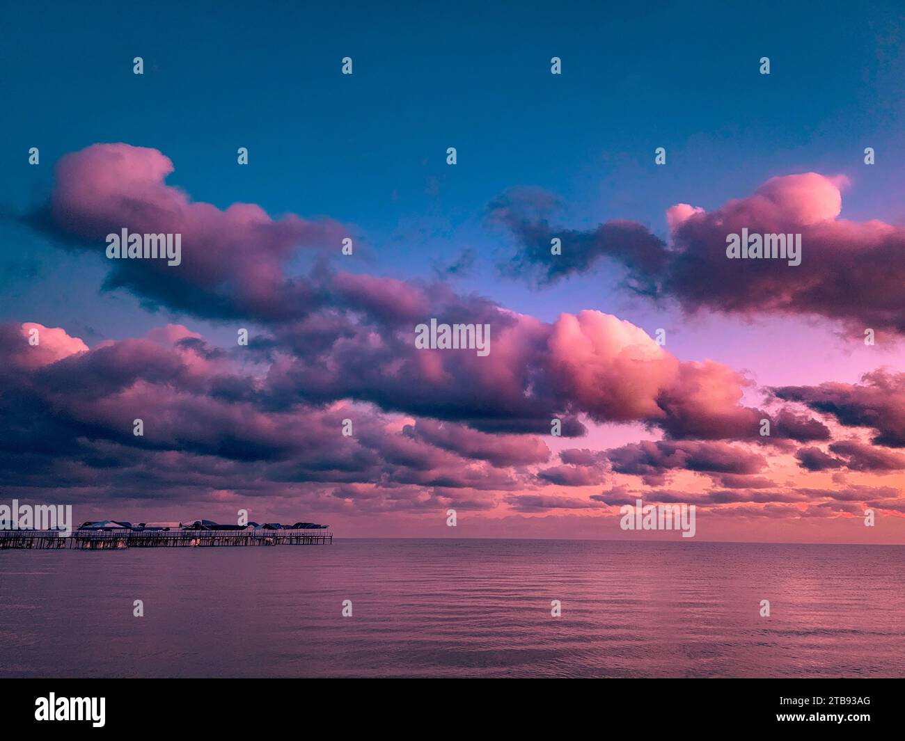Amazing colorful sunset over lake with huge cloud Stock Photo - Alamy