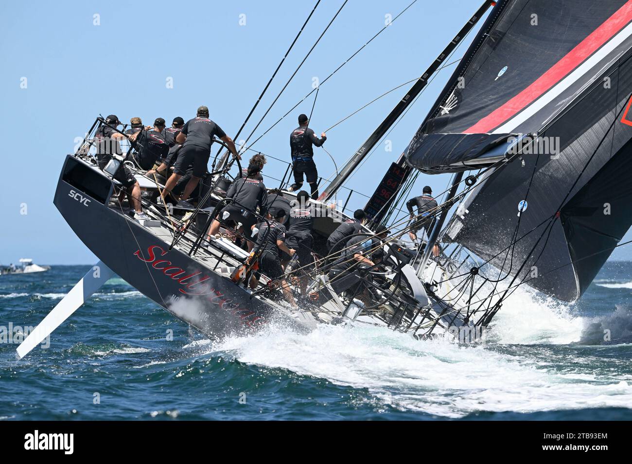 Sydney Harbour, Sydney, Australia. 5th Dec, 2023. 2023 Solas Big Boat Challenge; maxi yacht SHK Scallywag skippered by David Witt sails down the harbour during the Solas Big Boat challenge Credit: Action Plus Sports/Alamy Live News Stock Photo