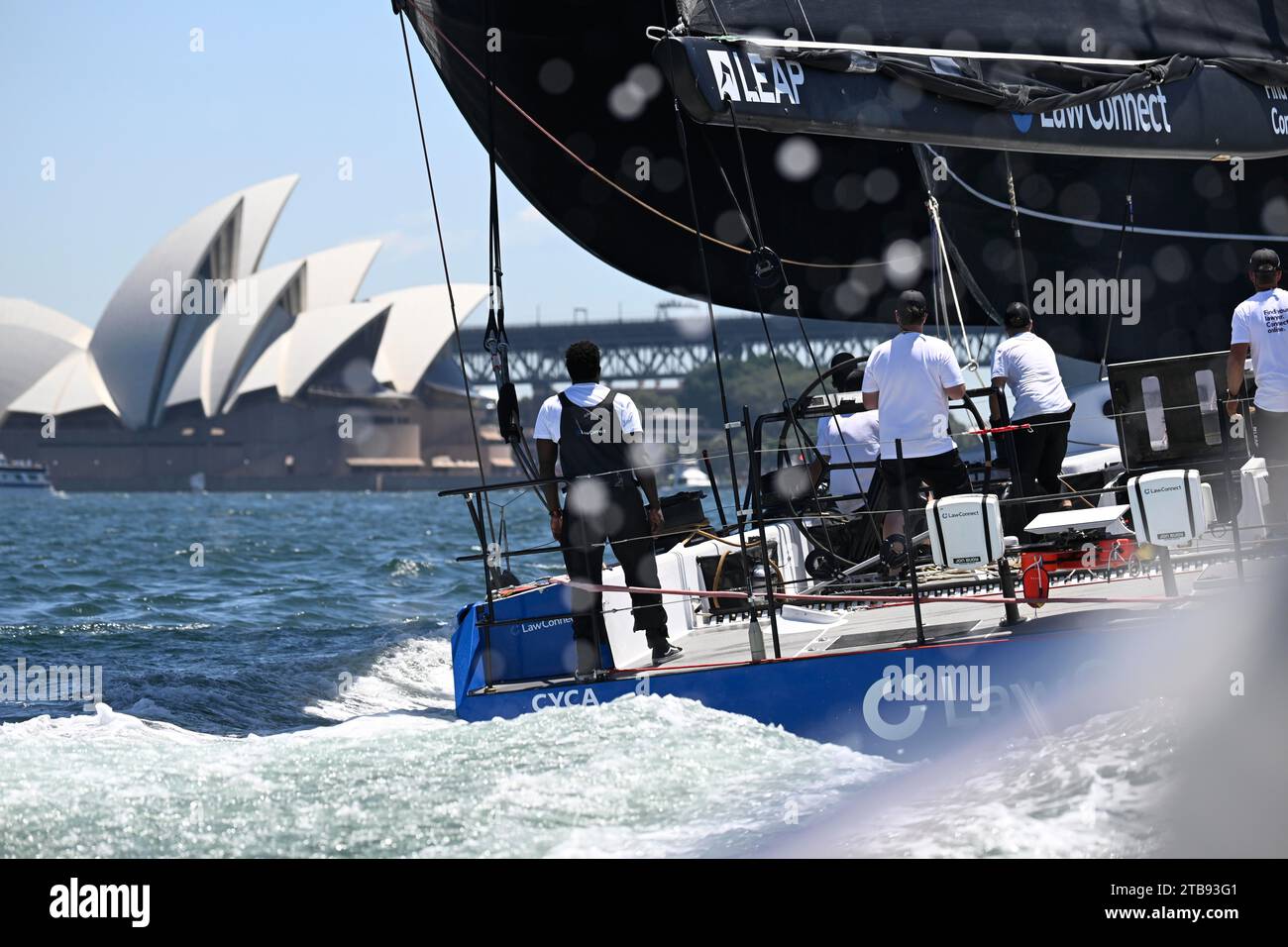 Sydney Harbour, Sydney, Australia. 5th Dec, 2023. 2023 Solas Big Boat Challenge; maxi yacht LawConnect skippered by Christian Beck wins the race in front of the Sydney Opera House during the Solas Big Boat challenge Credit: Action Plus Sports/Alamy Live News Stock Photo