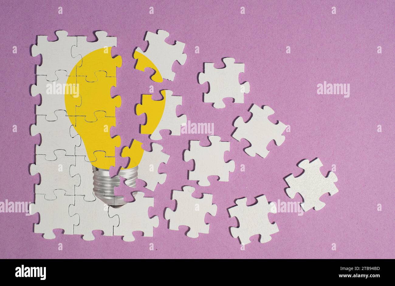 Business concept,innovation,ideas Personal development, human resources,recruitment,team building with jigsaw puzzle pieces and lightbulb Stock Photo