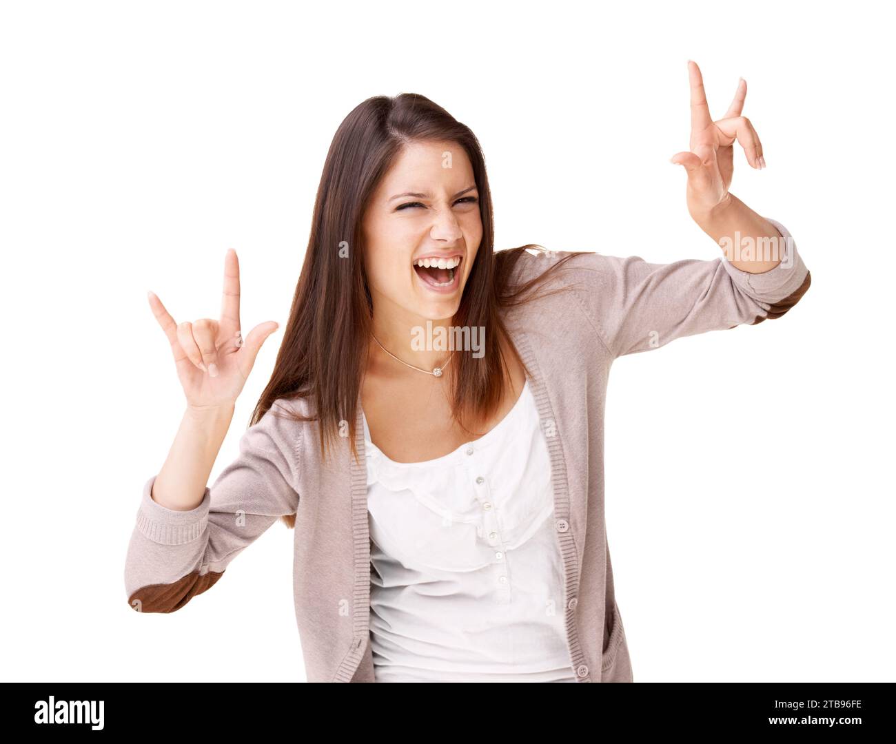 Rock, music and portrait of woman with sign for metal, culture or freedom in studio white background. Crazy, girl and excited fan at concert and Stock Photo