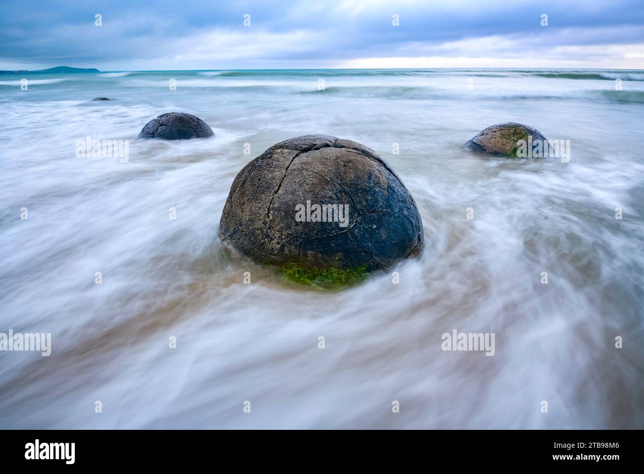 The Moeraki Boulders are large and spherical boulders lying along a