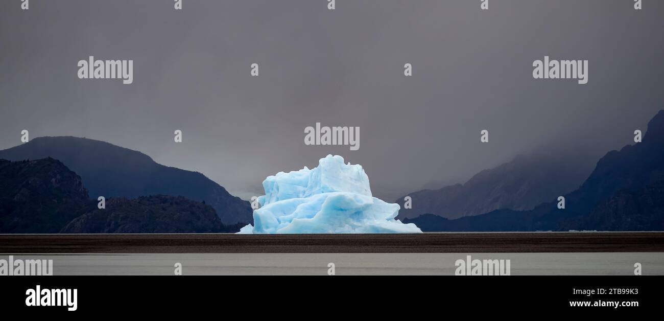 Large iceberg off the glacier at Lago Grey has been blown by the wind close to the beach in Torres del Paine National Park; Patagonia, Chile Stock Photo