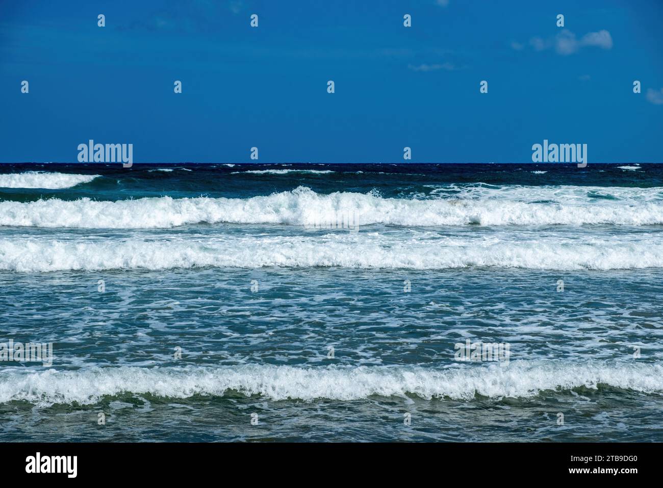 Greece, ripple dark sea water, splashing white foam, Greek blue sky ...