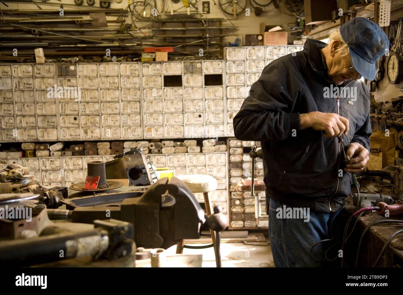 Senior man busy in his workshop; Cortland, Nebraska, United States of America Stock Photo