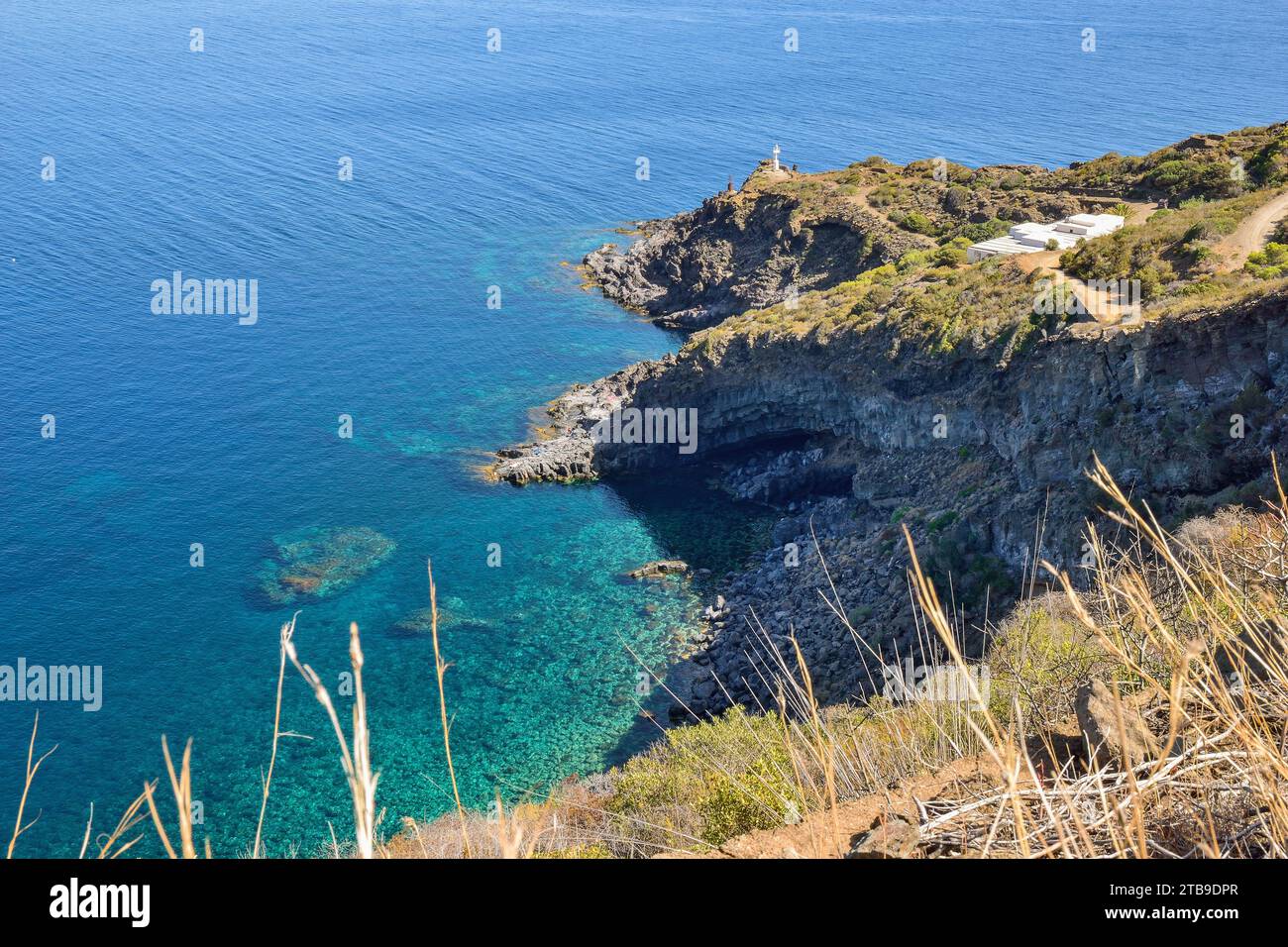 Panoramic view on Punta Limarsi with the lighthouse on the promontory, Pantelleria Stock Photo