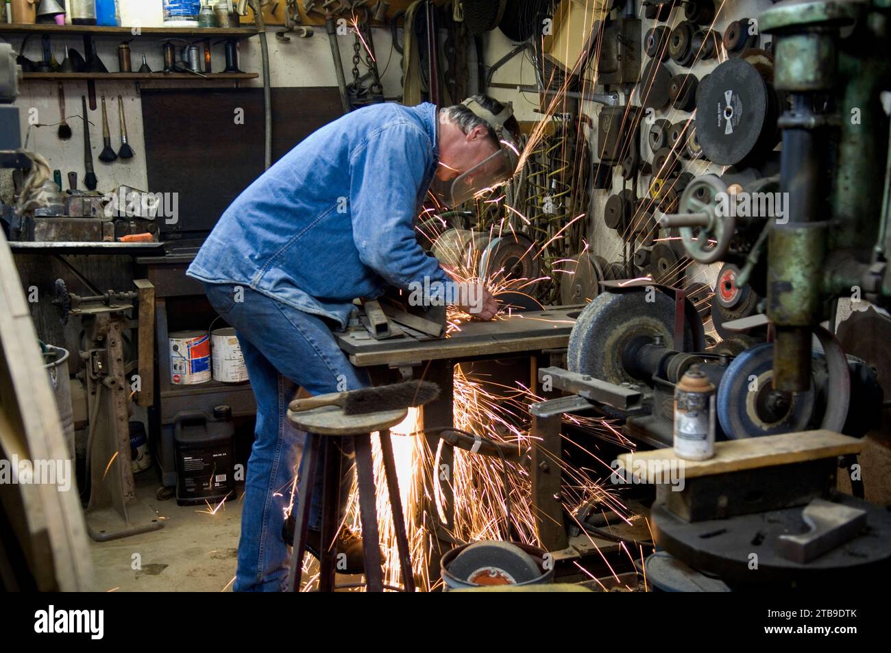 Man working in his workshop; Cortland, Nebraska, United States of America Stock Photo