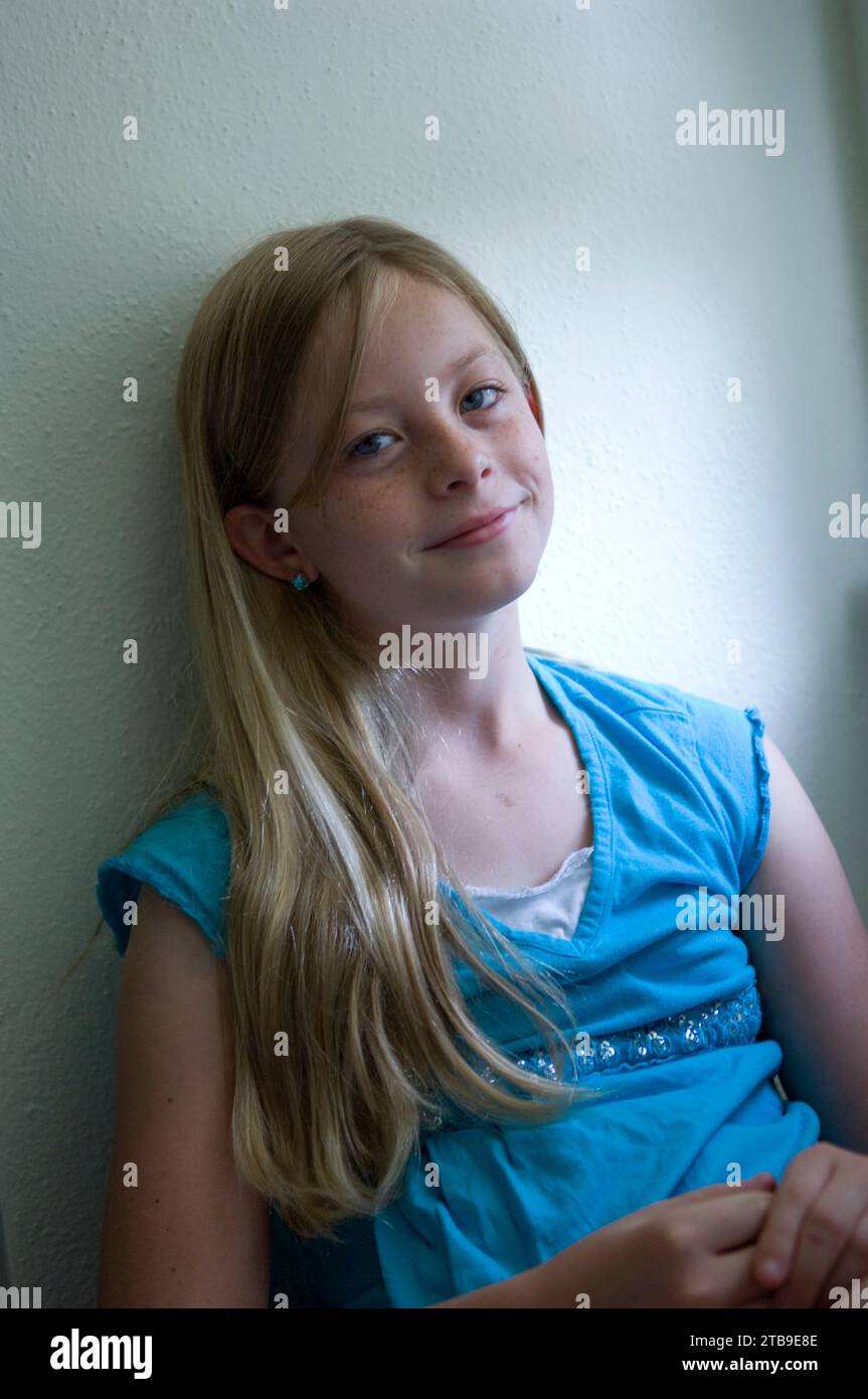 Portrait of a young girl sitting in natural light; Lincoln, Nebraska, United States of America Stock Photo
