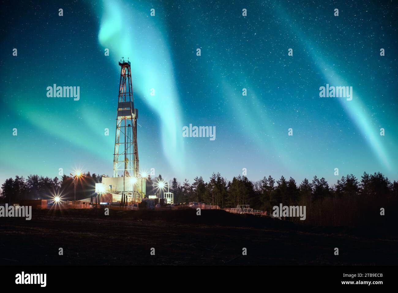 Aurora borealis Northern lights over oil gas drilling rig. Industrial concept Stock Photo